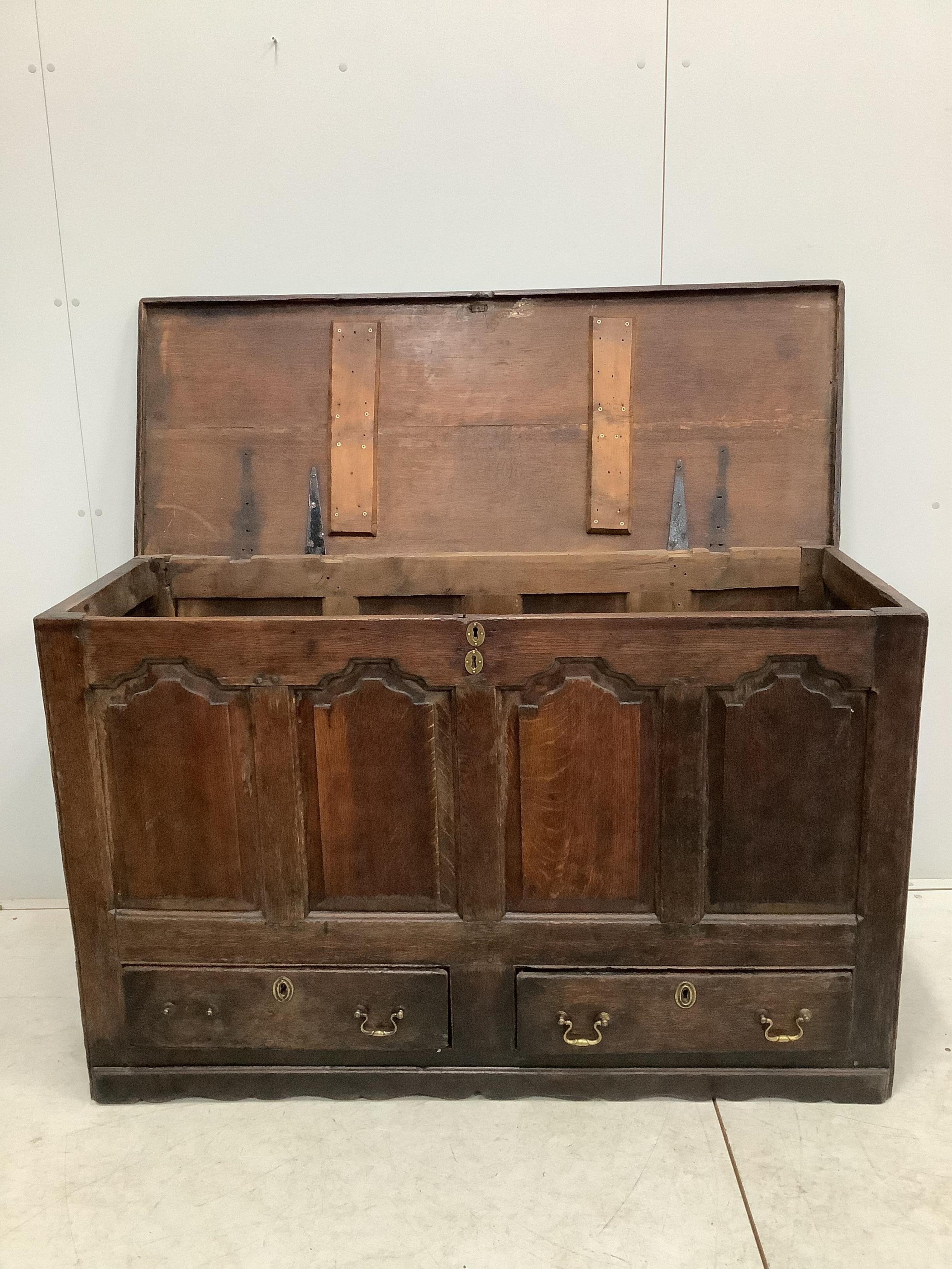 An 18th century oak mule chest, width 140cm, depth 53cm, height 88cm. Condition - fair